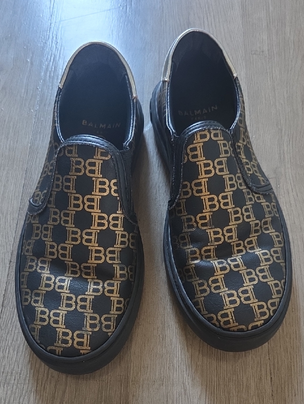 Balmain Black and Gold Monogram Slip-On Sneakers